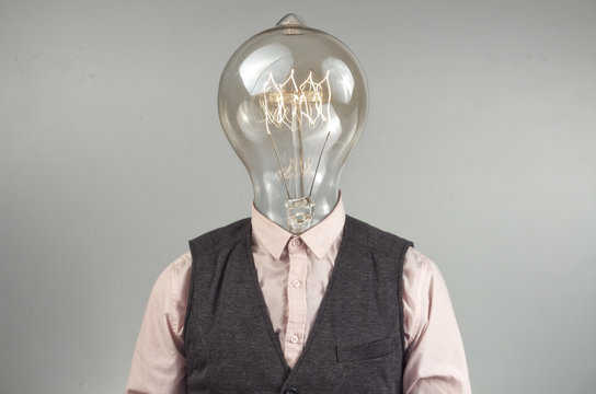 Man torso with a light bulb as head