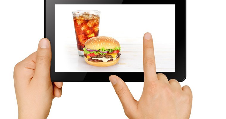 Ordering a burger and soda online through tablet