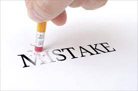 An eraser in pencil deleting the word Mistake
