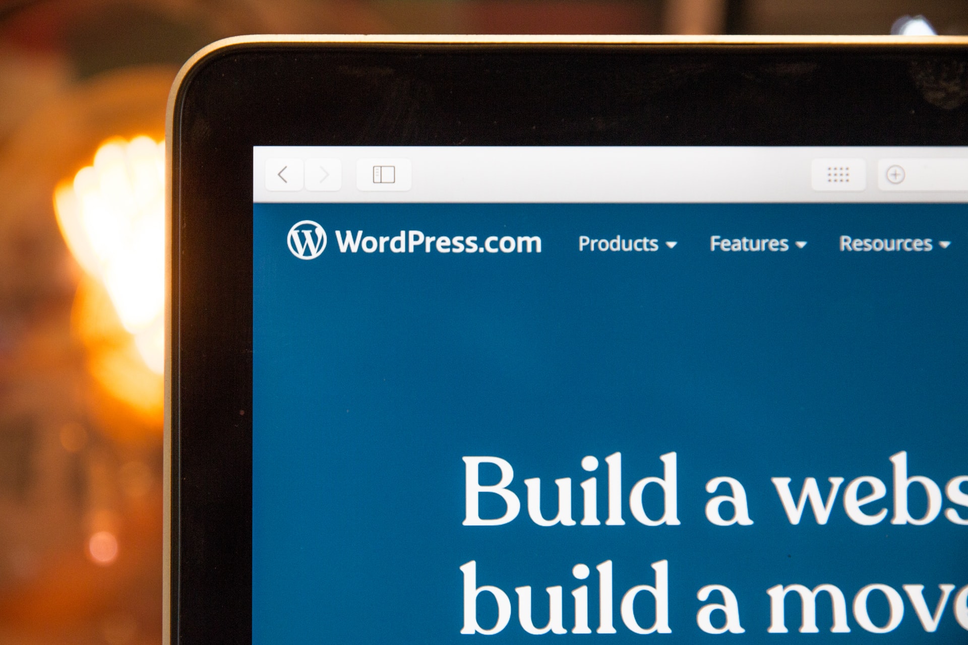 Upper left corner part of WordPress.com homepage as seen on a laptop screen