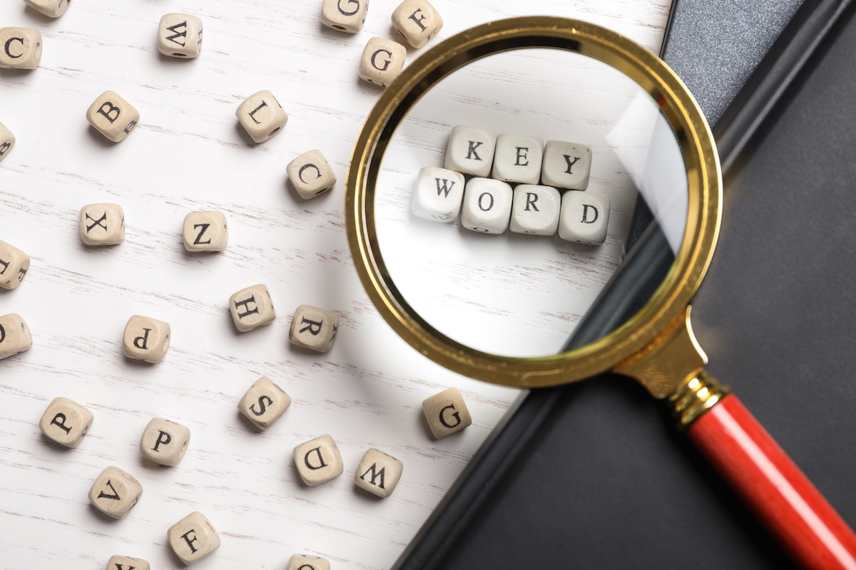 Keywords letter block in a magnifying glass