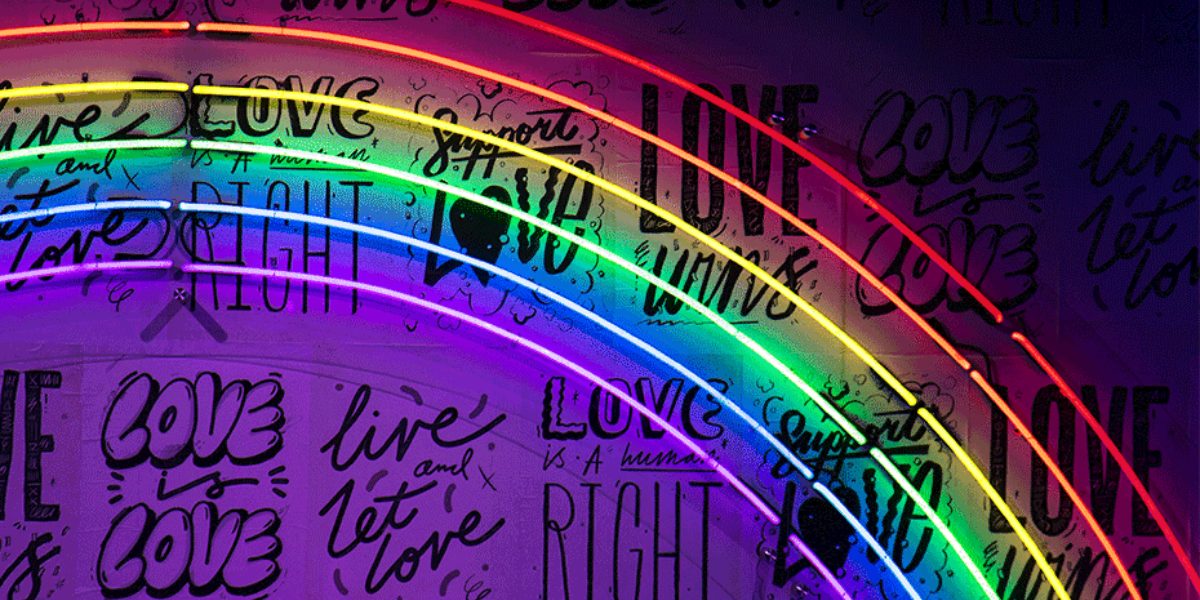 A rainbow led lights with love and pride quotes on the back