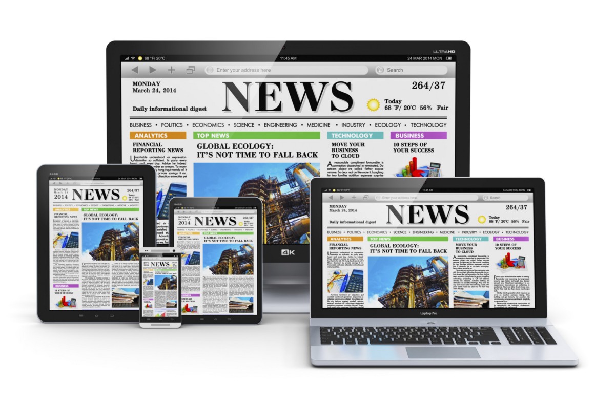 News website in a laptop, tablets, phone, and a monitor