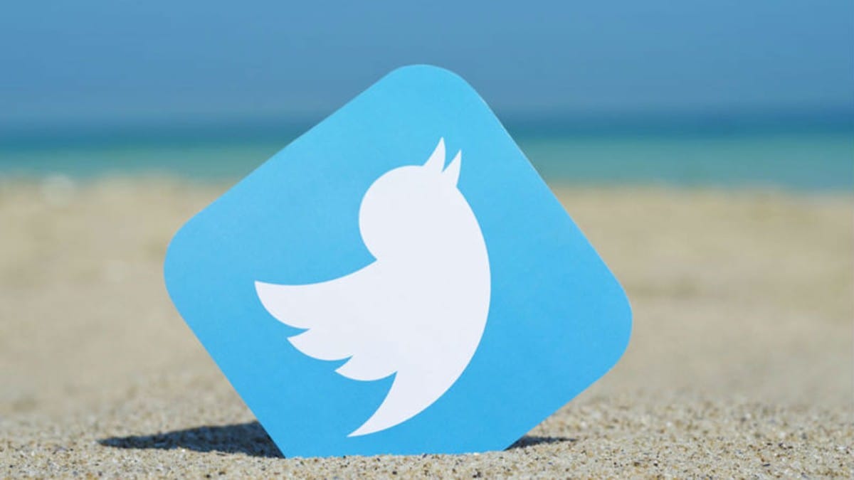 Twitter logo in a sand