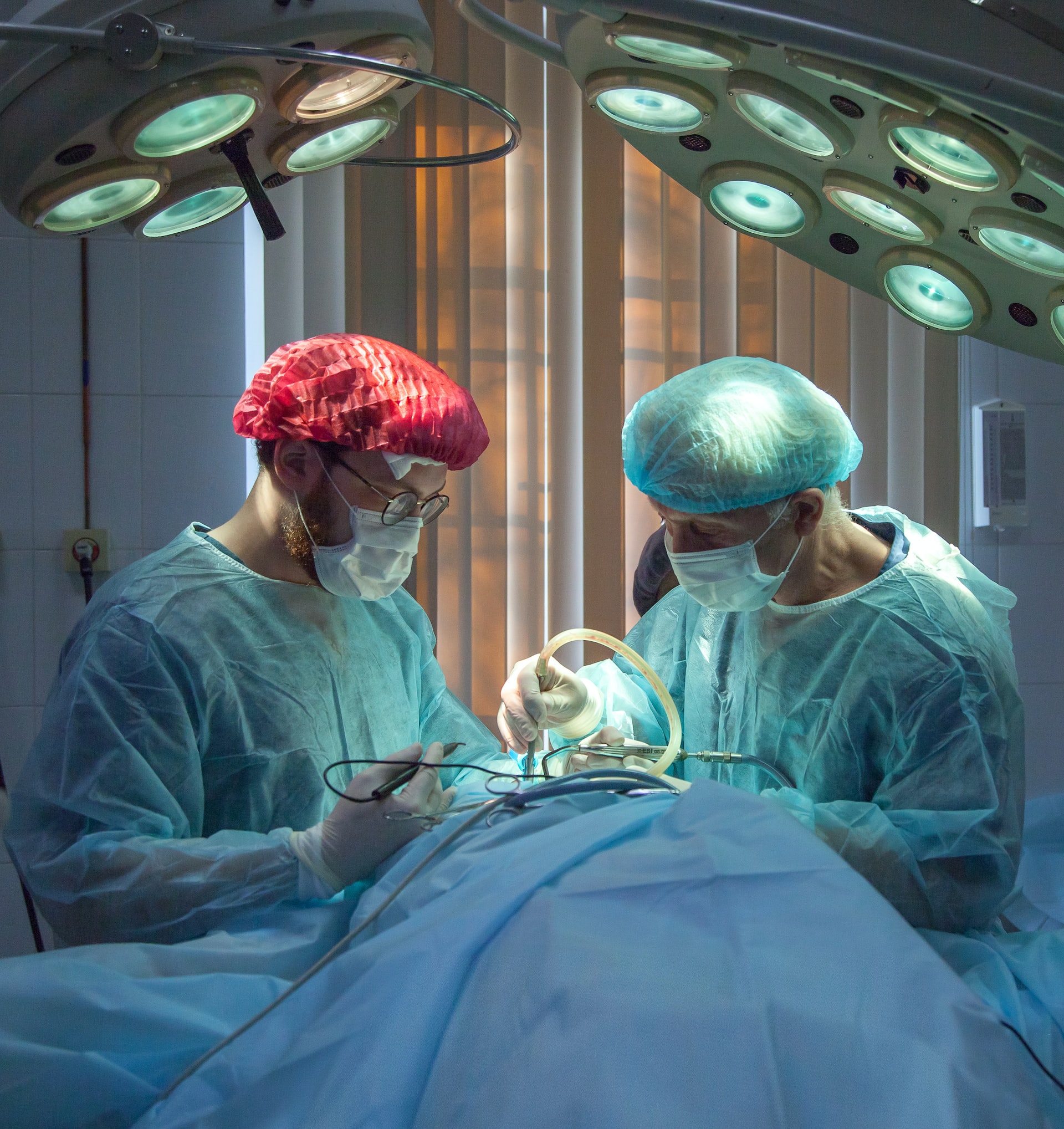 Two doctors performing a surgery