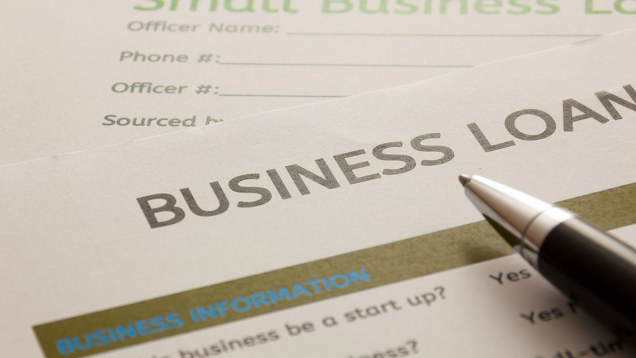 A Business loan form and a pen