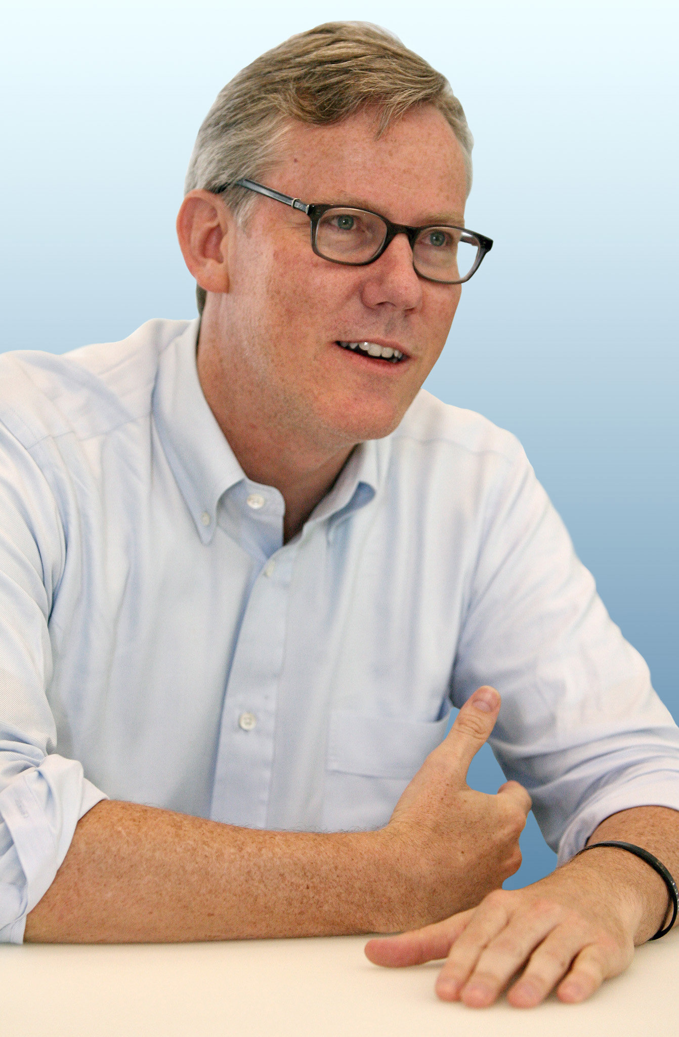 Brian Halligan wearing a white long sleeves and eyeglasses