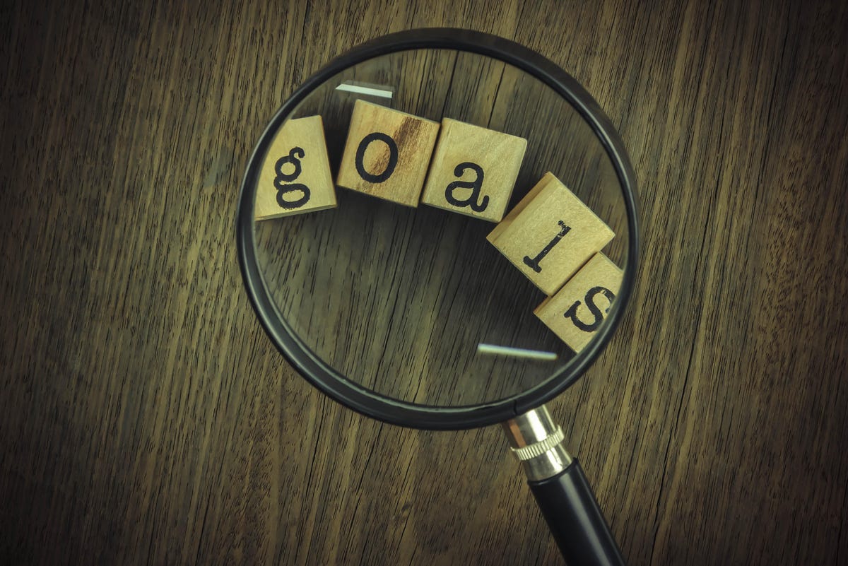 Word 'goals' in a magnifying glass