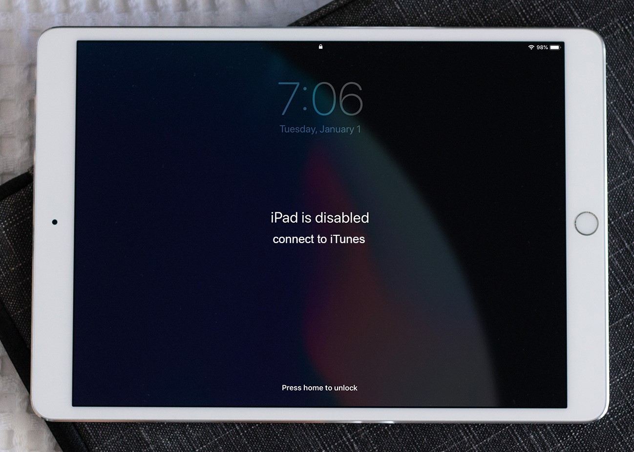A white disabled iPad with connect to iTunes prompt