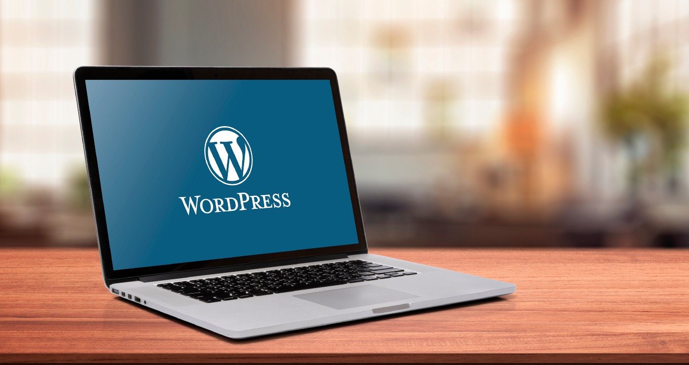 WordPress logo on a laptop