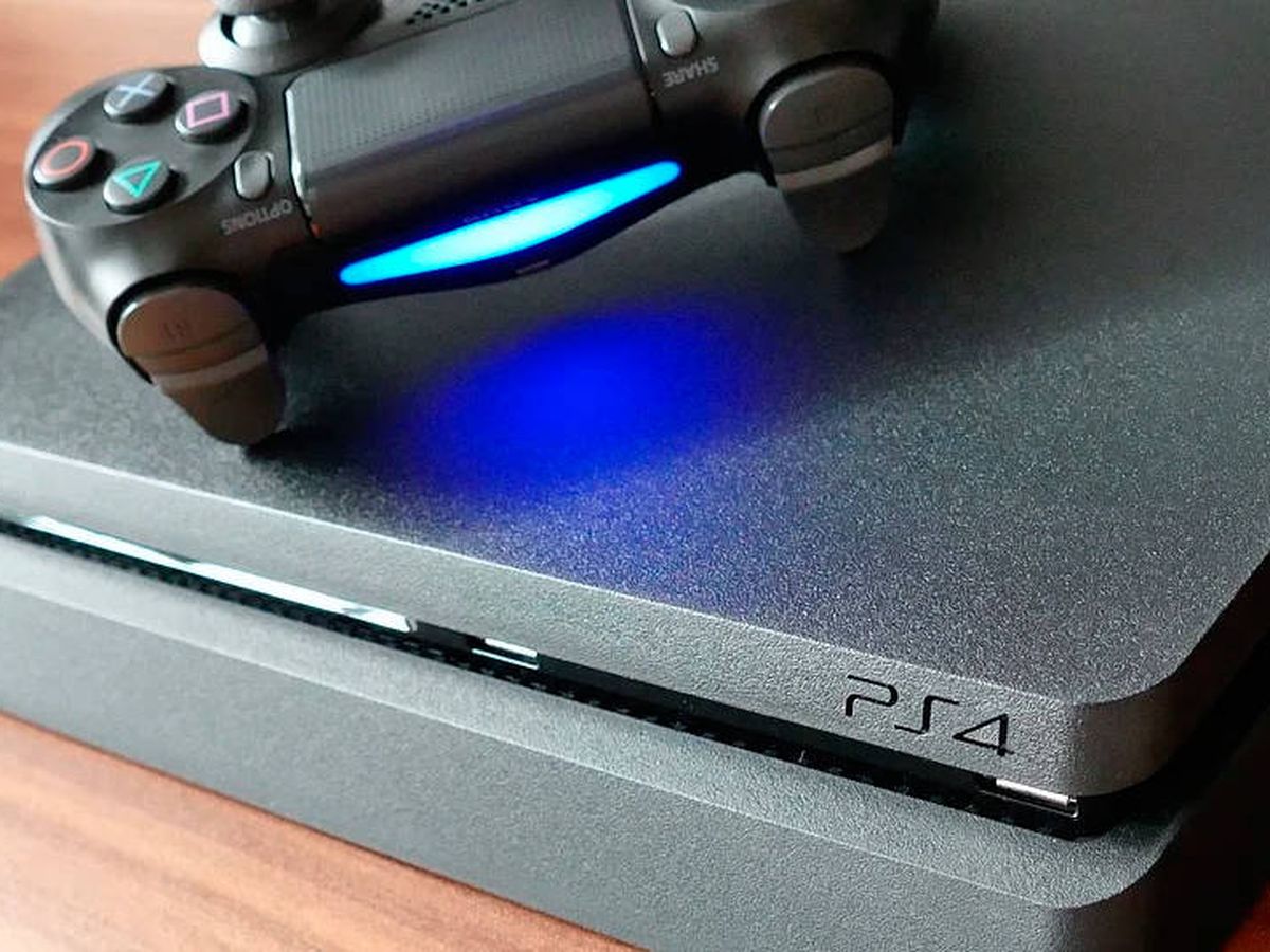 PS4 black console and controller