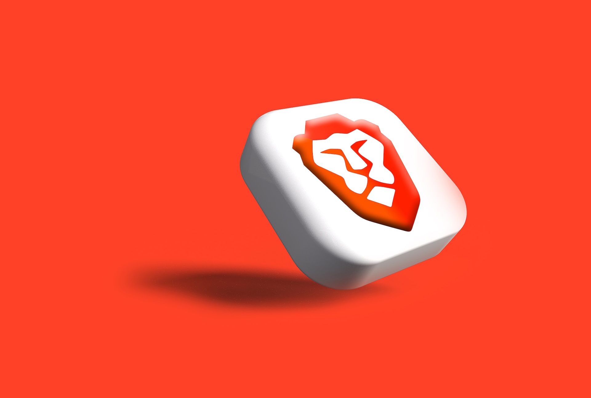 The orange-and-white lion face icon of Brave browser in a white squircle against a solid orange background