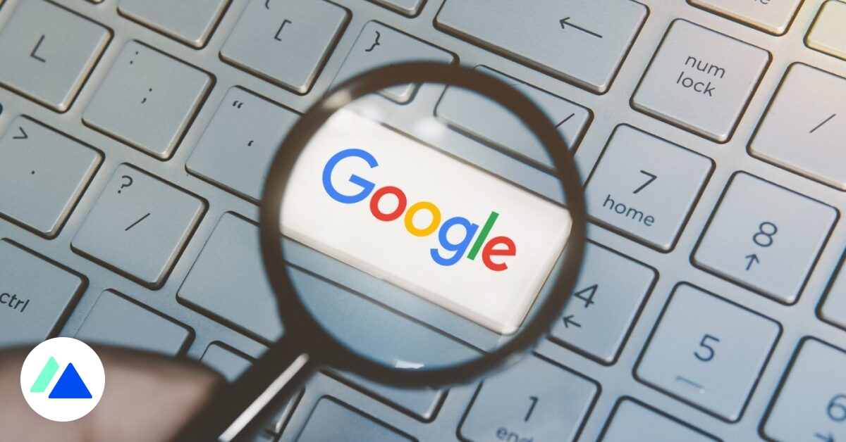 Google logo on a keyboard and a magnifying glass
