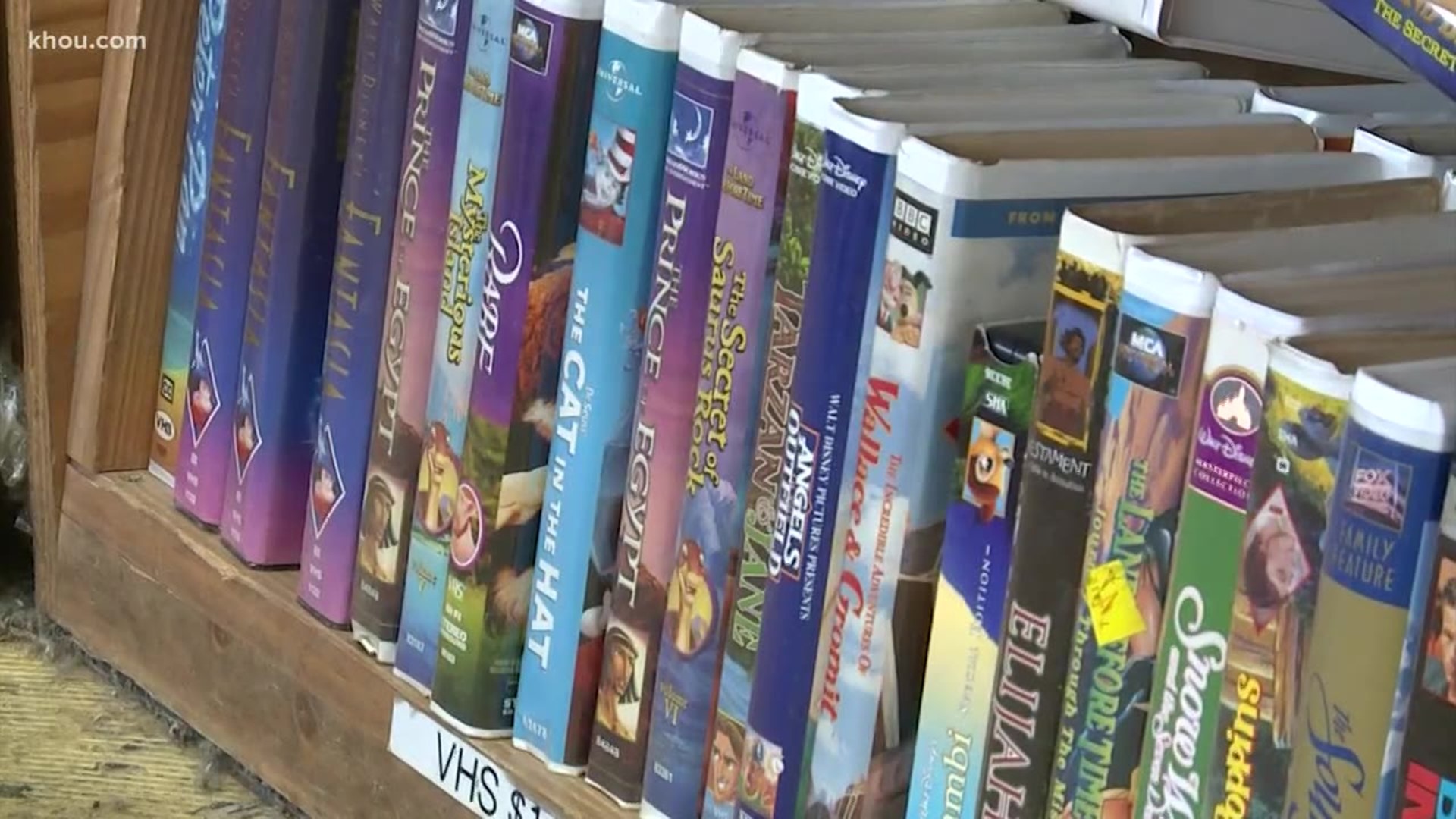 Different VHS tapes on a shelf