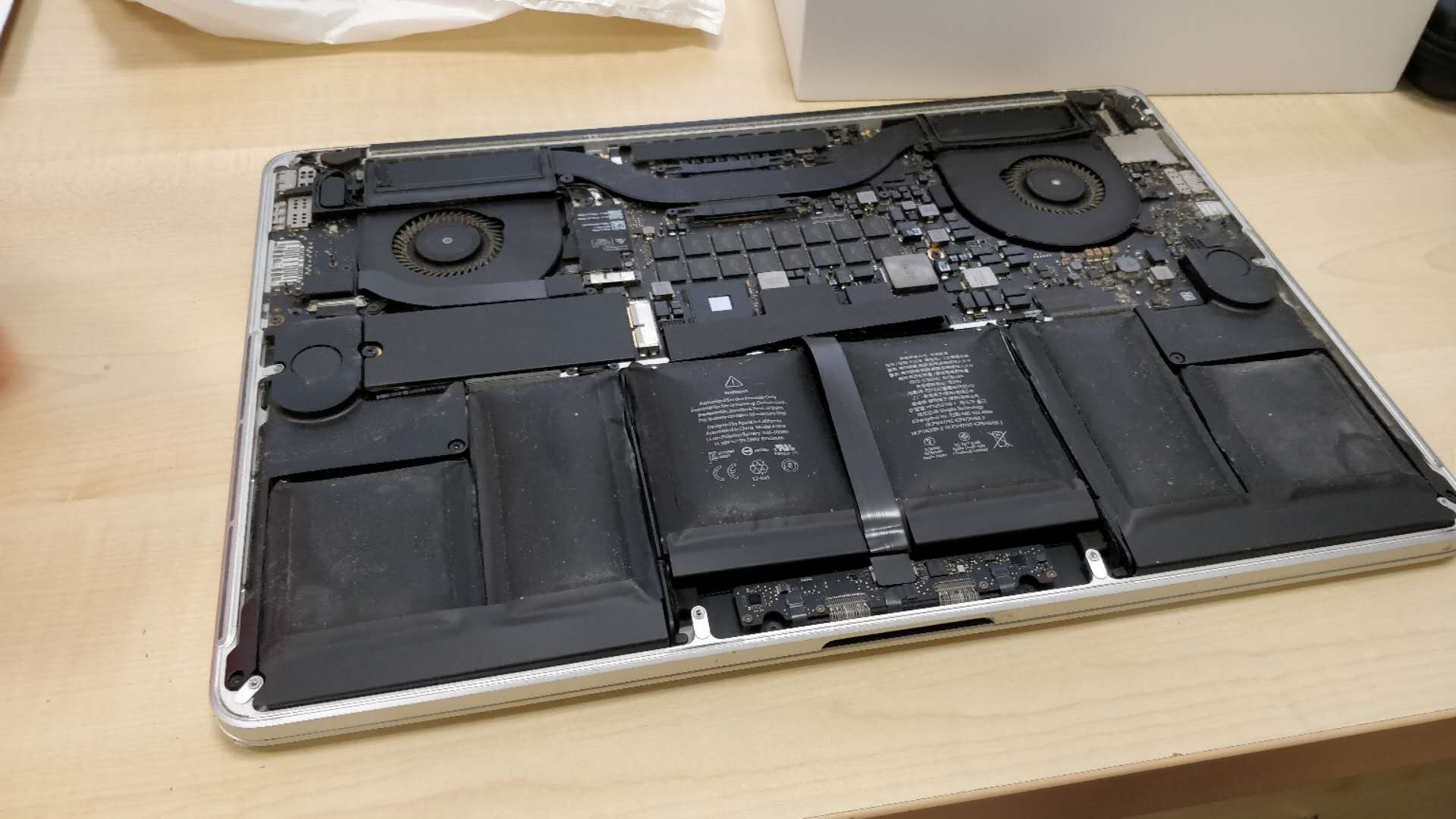 Two swollen batteries on a laptop
