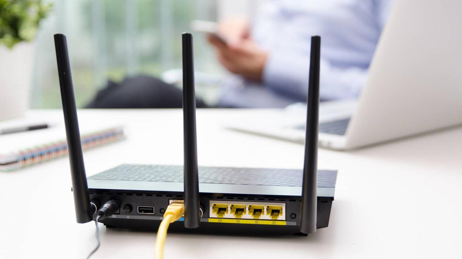 Black router with yellow cable