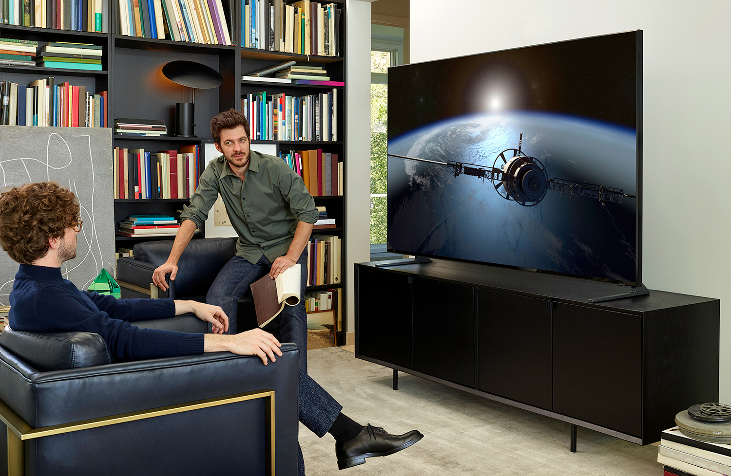 Two man in front of a Samsung TV