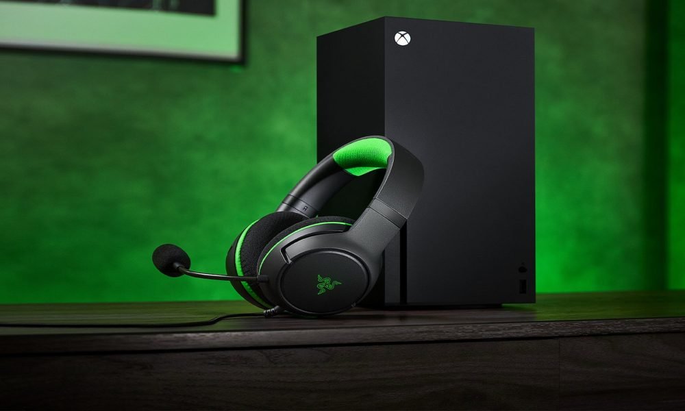 A black headphones and a black Xbox One
