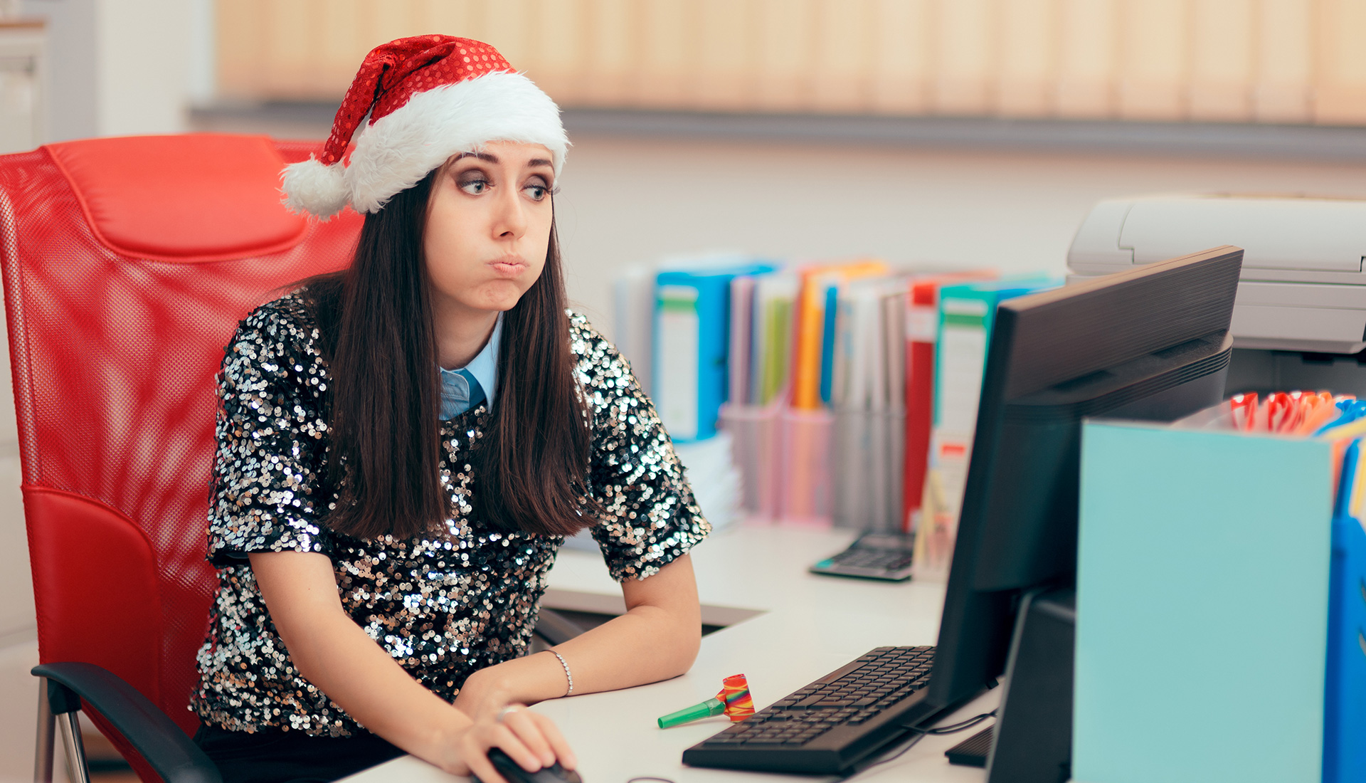 A female employee doing work in office on Christmas, sadly