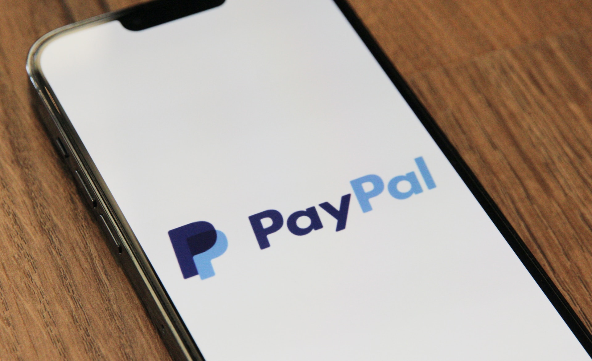 The official PayPal logo on a phone screen